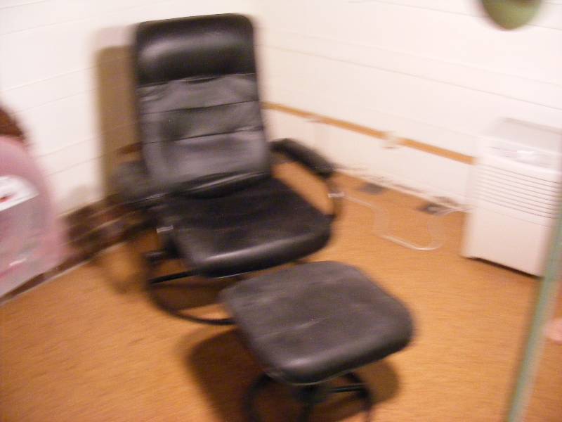 Reclining Black Leather Chair with Matching Footstool