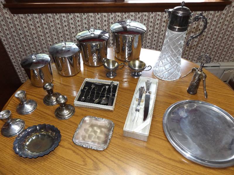 Silvercrystal pitcher, silver canister set, silver cream and sugar bowls, 4 candlebras, misc silver.