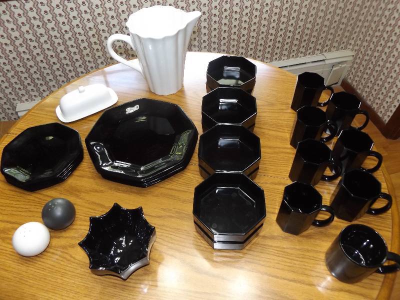 Black dish set (France) includes 8 lg plates, sm plates, 8 bowls, 7 & 2 mugs, 1 deco bowl, 1 white pitcher (Ceramica made in Italy), white butter dish, S&P.