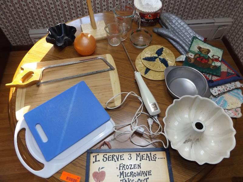 Cutting boards, meat saw, sign, hot pads, measuring cups, misc.