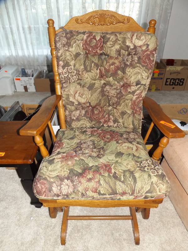 Glider rocker with cushions.