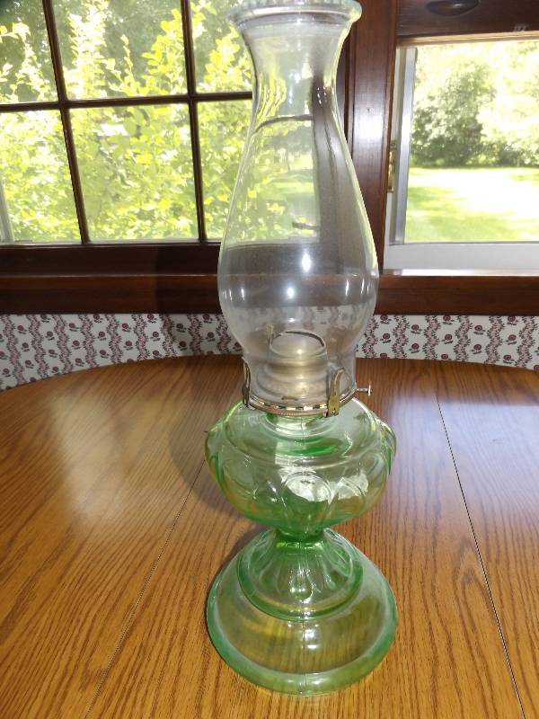 Green depression glass oil lamp.