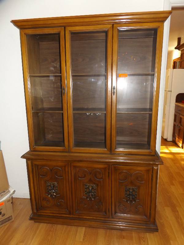 China cabinet with 3 doors and 3 glass doors.