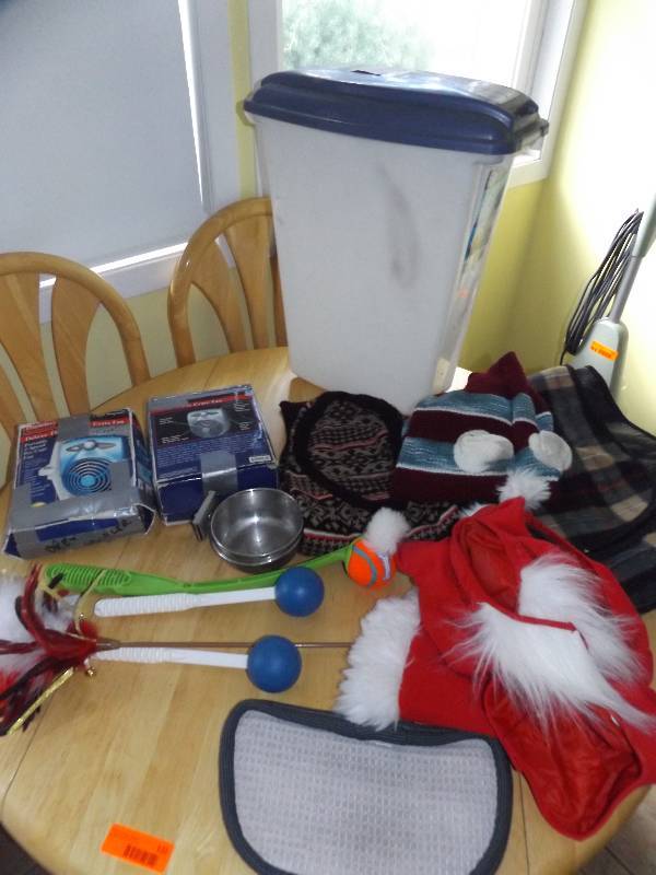 Dog costumes, blanket, crate fans, ball tosstrainers.