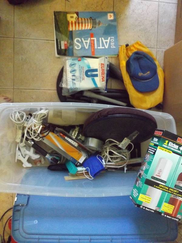 Tote with swivel seat, fire extinguishers, misc household.