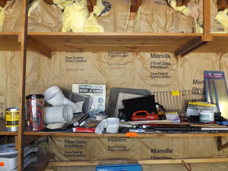 Shelf of various householdgarage items.