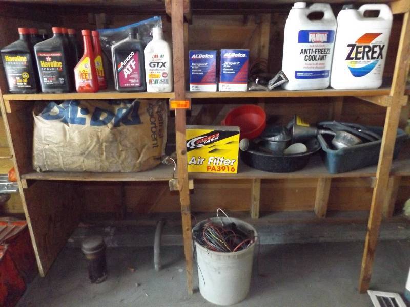 4 bottom shelves of automotive plus bucket of wiring.