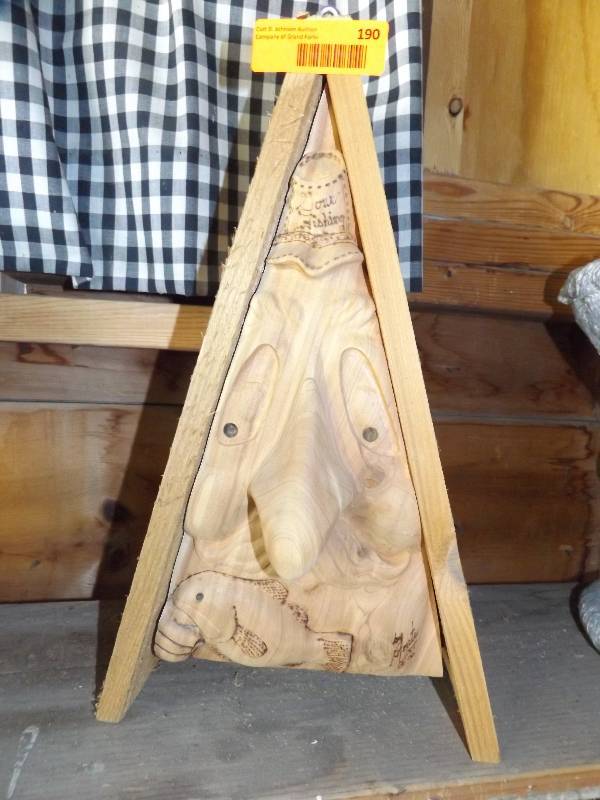 Carved wood birdhouse.