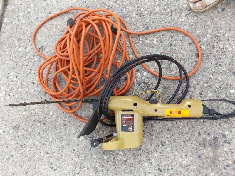 Black & Decker electric hedge trimmer and extension cord