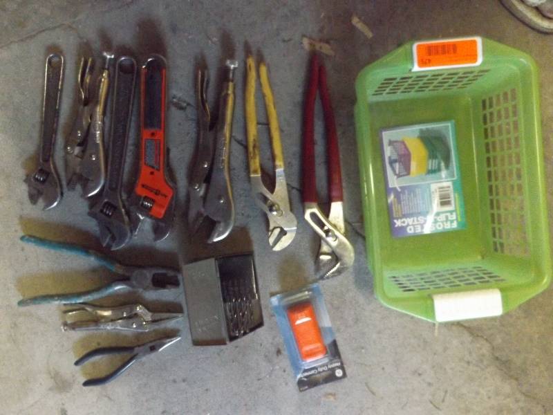 Vise grips, channel locks, drill bits, pliers