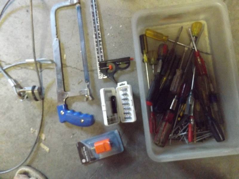 Hand saw, screw drivers, cable locks, mini screwdriver set, leveling ruler
