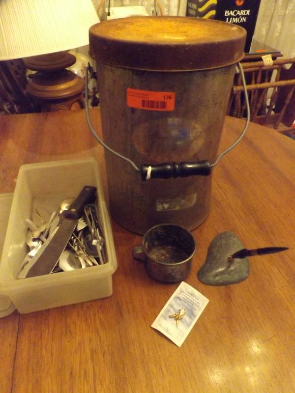 Can, variety of silverware, tin mug.