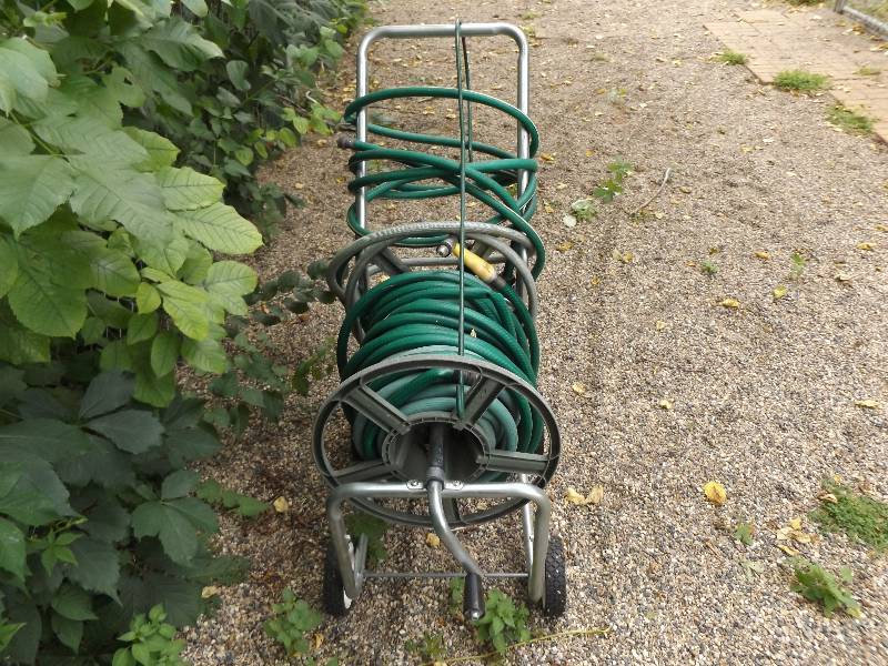 Garden Hose on Rolling Hose Holder BreyMarler Estate Auction KBID