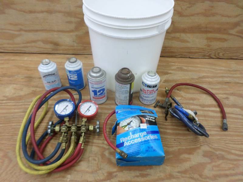 lot 34 image: Bucket Of AC Freon Recharge Accesso...