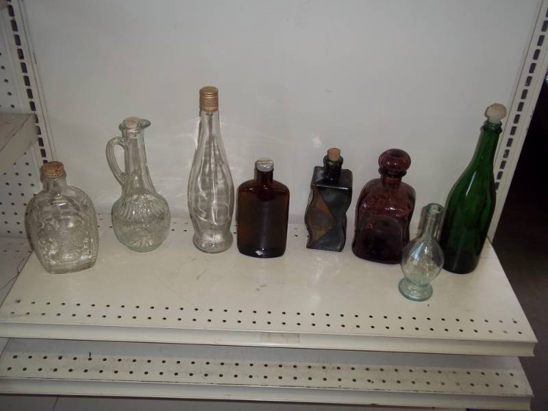 lot 31 image: Glass bottles with clear and brown glass