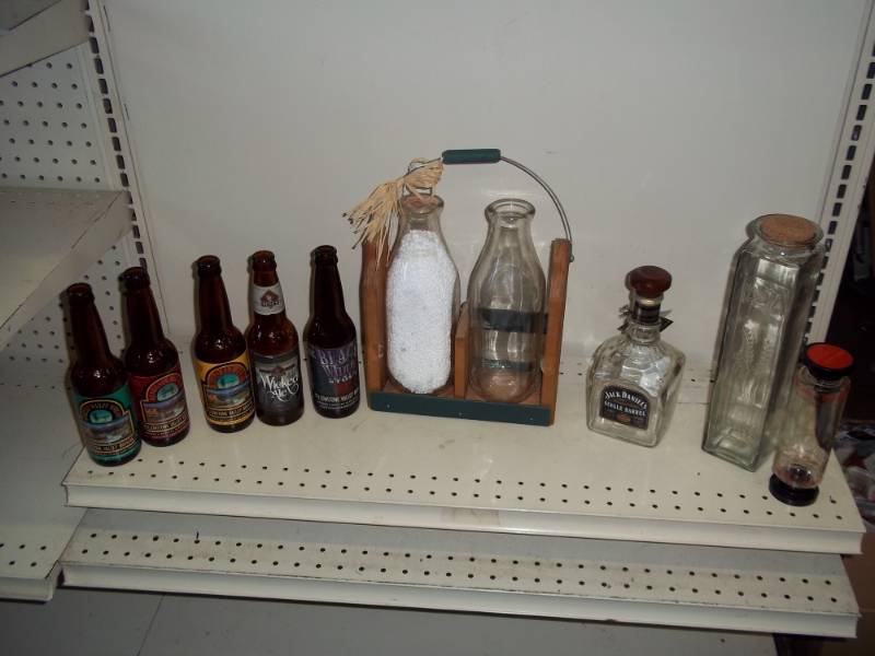lot 37 image: Milk bottle dcor with glassware and beer bottles
