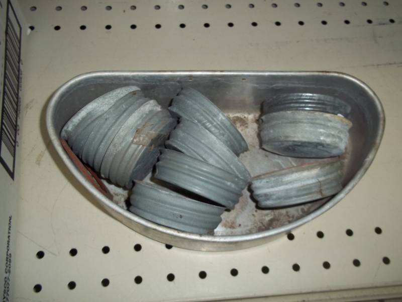 lot 54 image: Metal canning jar lids with tin