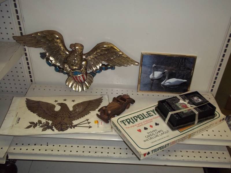 lot 128 image: Eagle dcor with swan pictures and game, wood car