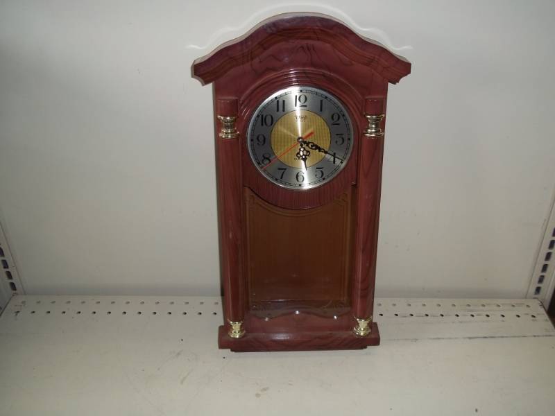 lot 157 image: Brown clock, musical