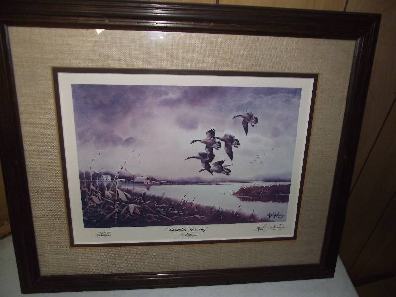 lot 3 image: 477500 - �Canada�s Arriving� by Les Kouba, matted, framed & resigned,