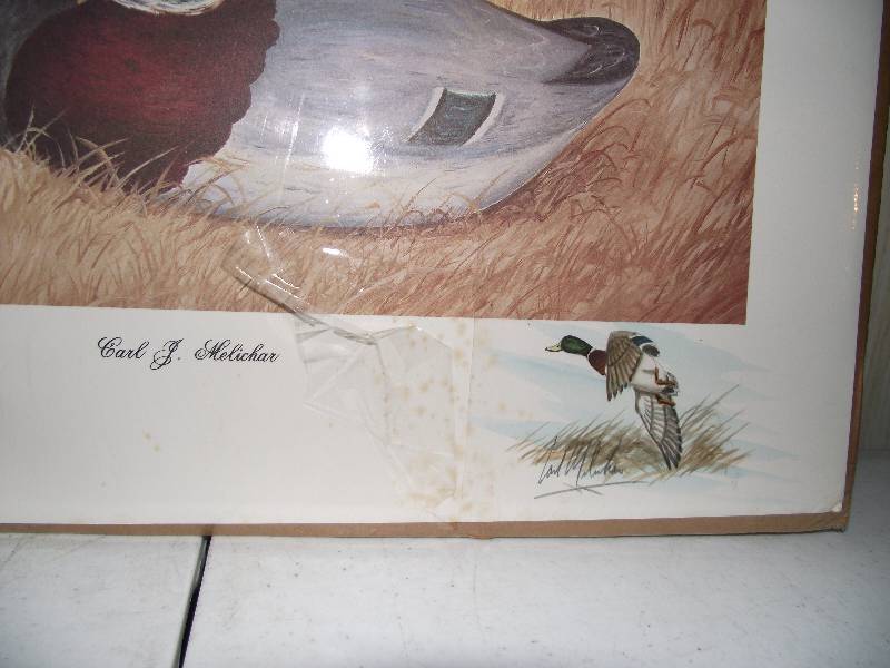 lot 43 image: 2581650 � �Black Lab Puppy with 1887 Dodge Decoy� by Carl J. Melichar, signed, resigned