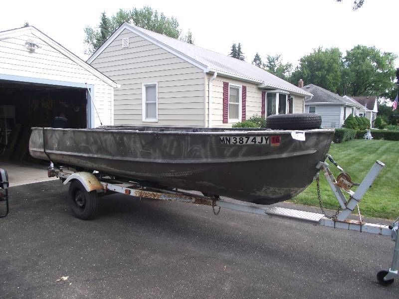 lot 1 image: 16 foot aluminum boat for waterfowl hunting and fishing.  70 inches wide and 30 inches deep