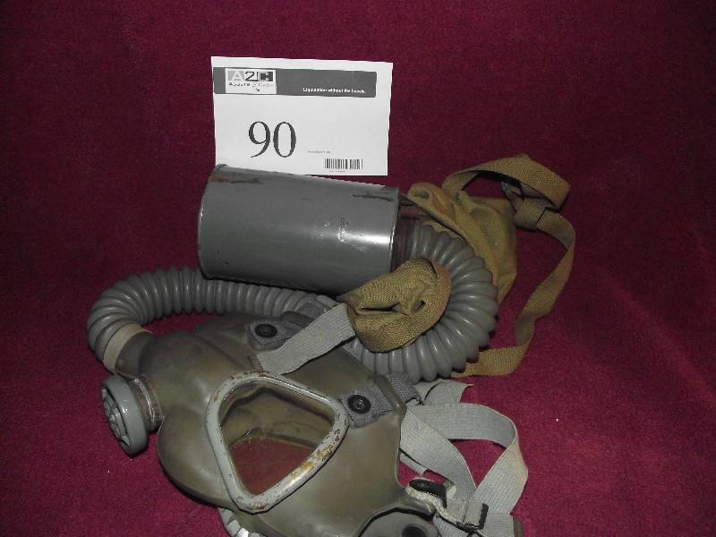 lot 90 image: Vintage military gas mask with canister and carrying case
