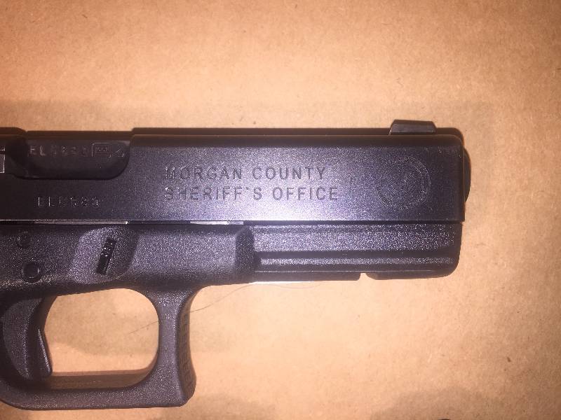 Glock G22 Semi-auto pistol with Morgan County Sheriff engraving