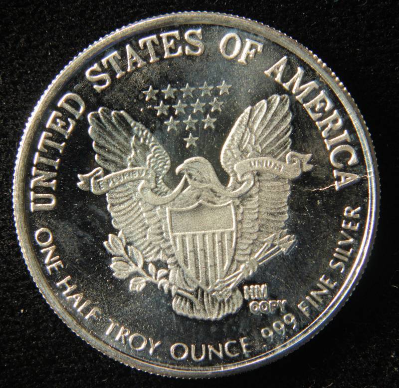 lot 45 image: 12 TROY OZ. SILVER ROUND WALKING LIBERTY DESIGN