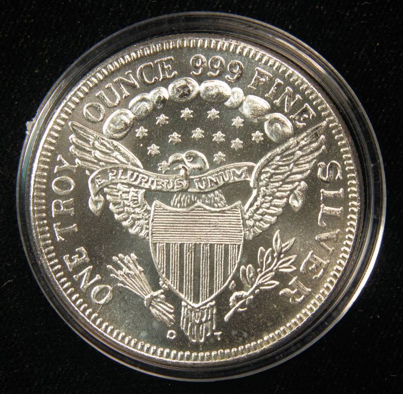 lot 49 image: 1 TROY Oz. .999 FINE SILVER ROUND DRAPED BUST STYLE IN PLASTIC HOLDER