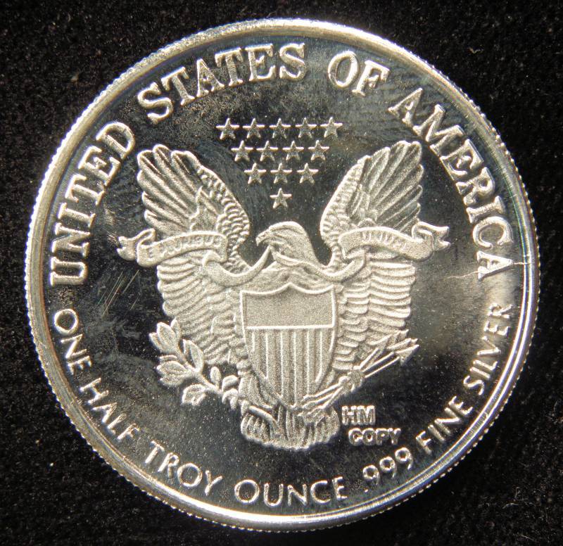 lot 56 image: 12 TROY OZ. SILVER ROUND WALKING LIBERTY DESIGN