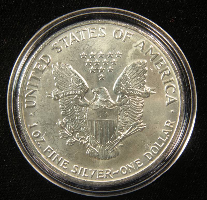 lot 60 image: 1991 AMERICAN SILVER EAGLE 1 TROY OZ. .999 FINE SILVER DOLLAR UNC IN AIRTITE CAPSULE