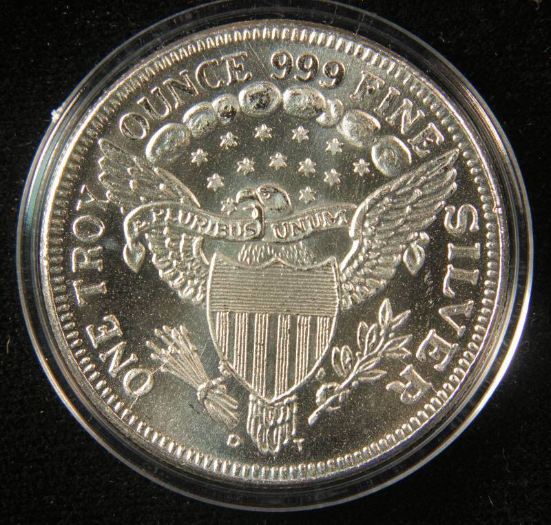 lot 70 image: 1 TROY Oz. .999 FINE SILVER ROUND DRAPED BUST STYLE IN PLASTIC HOLDER