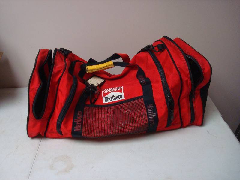 lot 55 image: Marlboro Duffel  Bag, Has Tear Inside