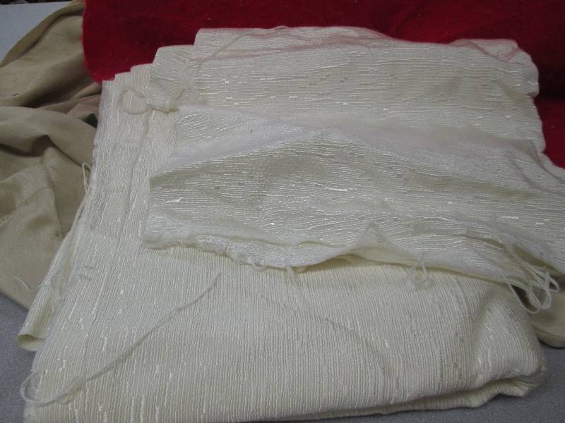 Assortment of size of off white fab...