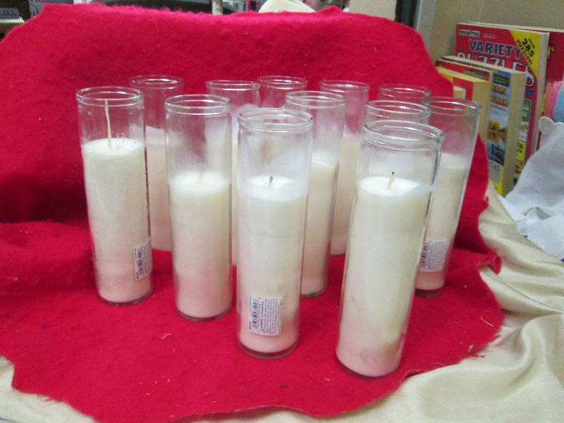 Qty 12 white pillar candles...
