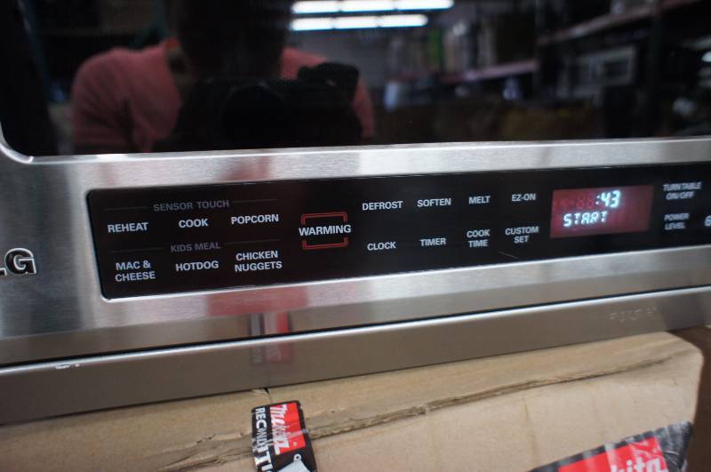 lot 11 image: LG Microwave - Model # (LMHM2017ST)