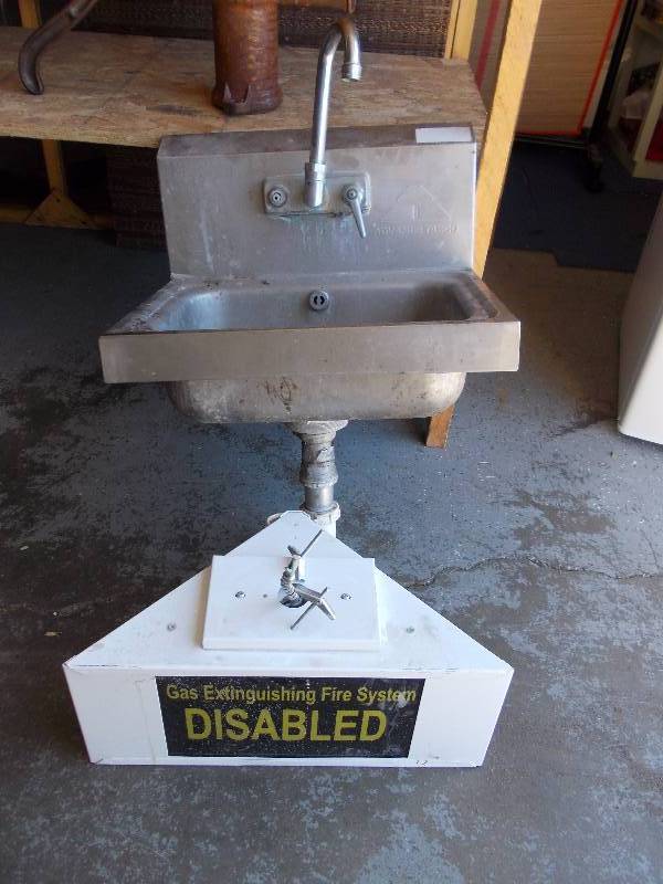 lot 5 image: Stainless Steel Sink With Faucet & Sign