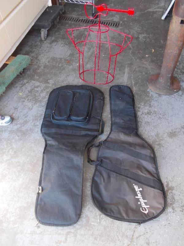 lot 8 image: 2-Guitar Cases, 1-Wire Mannequin With Guitar Topper