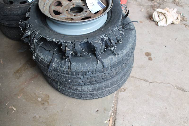 lot 77 image: Lot of (3) Tires wRims (1) Tire Is Blown Out.