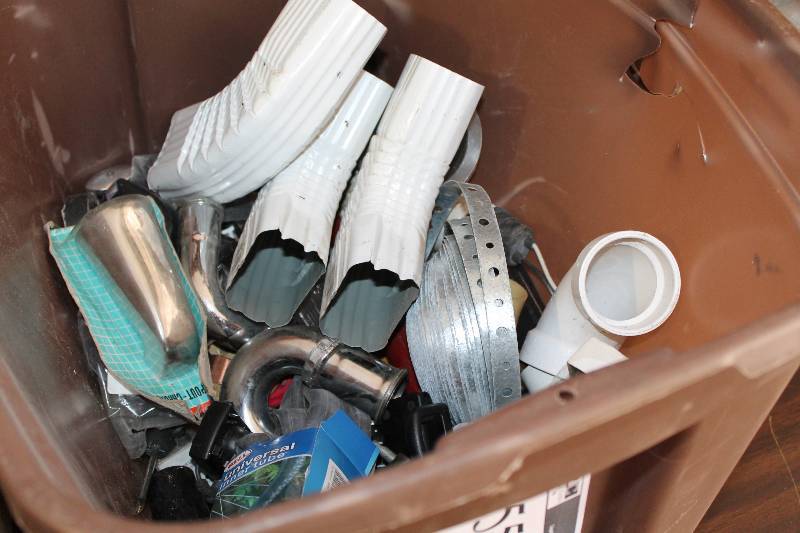 lot 55 image: Box Lot Including Metal Gutter Bends Metal Strap PVC Pipe And More.