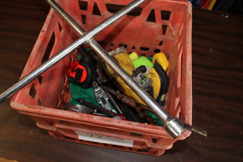 lot 72 image: Tote Lot Including Metal Fork Tools Tire Iron Measuring Tape And More Tote Not Included.