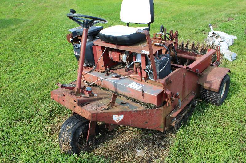 lot 23 image: Olathe Aerator with Onan 20 HP Engine wGround Aerating Attachment 424 Hours Model P220G-10940G SN K963611631 Operational 60 x 96 x 53. One rear flat tire.