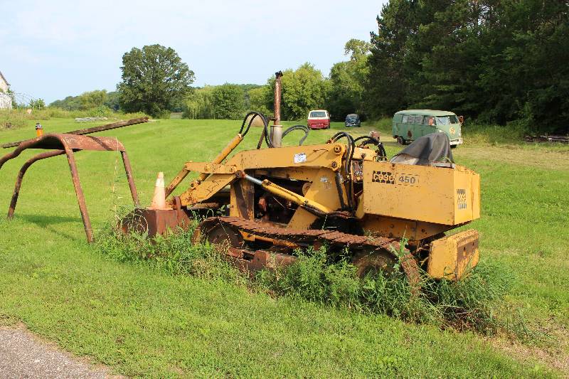 lot 21 image: Case 450 Skid Steer Loader wFront Bucket Attachment, Tread Trax & Large Cage Attachment 3925 Hours Model D450 NC 4212228 Not Running 72 x 168 x 96.  Roll Cage Included.