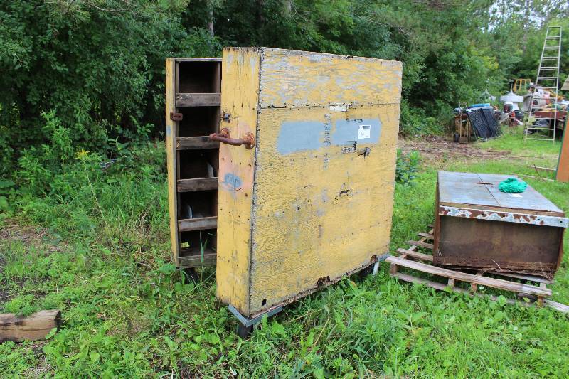 lot 30 image: Wooden Storage Unit w2 Sections Multiple Cubbies Per Section Wheels Locking Latch 60 x 22 x 70.