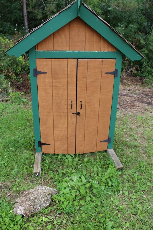 lot 33 image: Wood Garden Shed wDouble Doors, Multiple Shelves, Locking Latch, Shingled Roof 69 x 30 x 84.