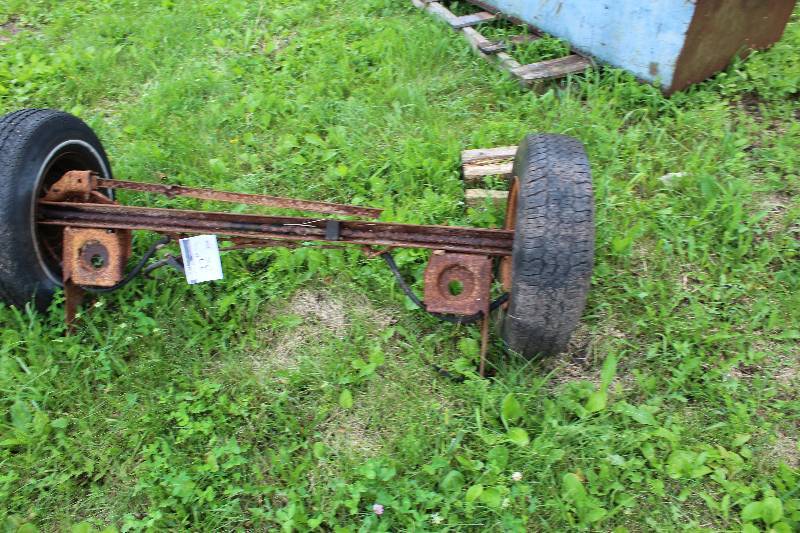 lot 32 image: Wheel Axle wTires & Rims 64 Width.