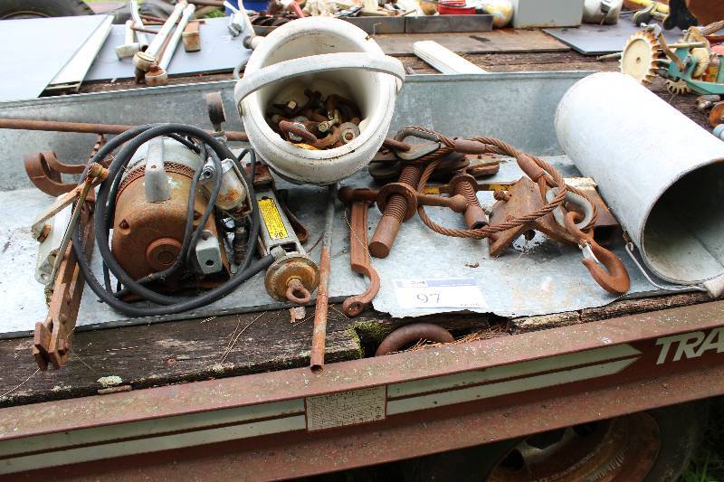 lot 97 image: Table Lot Including Miscellaneous Motor wPressure Gauge Bucket of Miscellaneous Hardware Automotive Jack And More.
