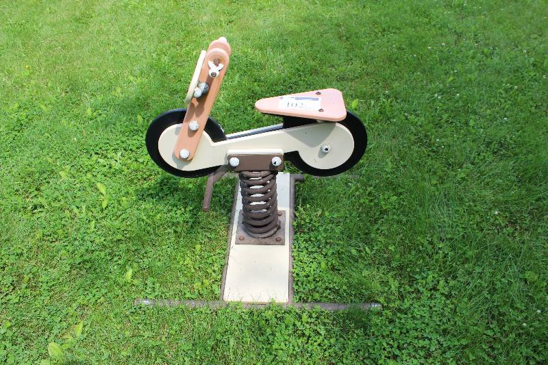 lot 102 image: Kids Motorcycle Mounted On A Spring wBase Platform Handles & Seat Playground Toy.