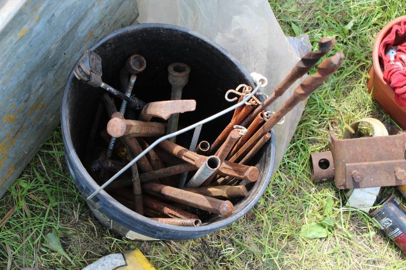 lot 109 image: Bucket Lot Including Tire Iron Metal Spikes  Stakes Metal Gears And More.